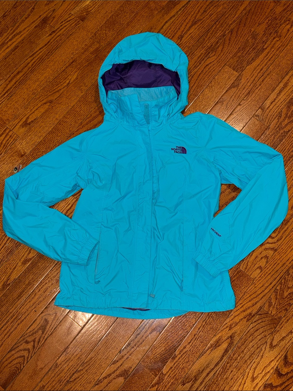 The North Face women’s small Turquoise Hooded Rain Jacket